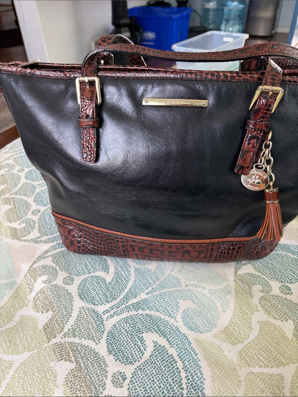 BrahminBlack and Brown Leather Tote with Tassel Charm